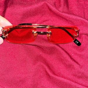 Glasses they are red kind of pink